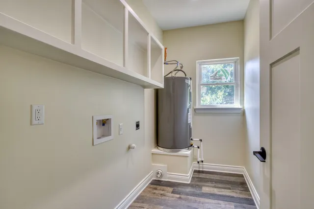 a view of front door with furniture and a window
