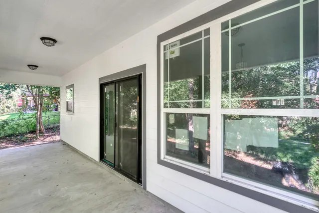 a view of a glass door and front door
