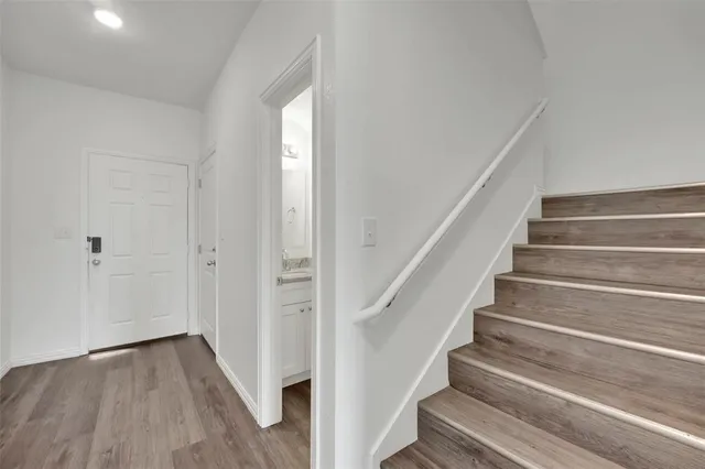 a view of entryway with wooden floor
