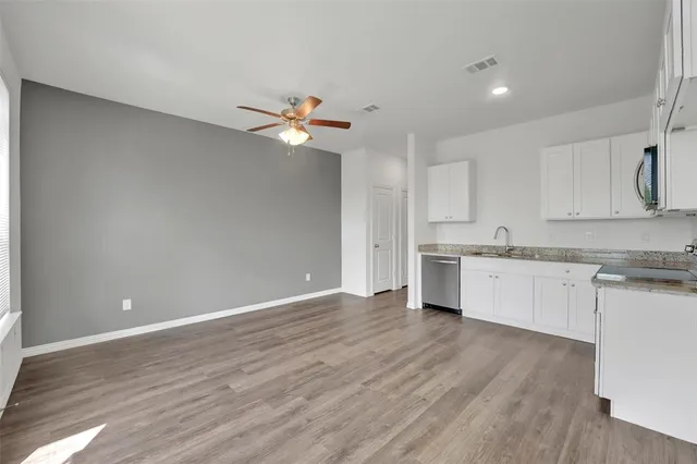 a view of a kitchen with electric appliances