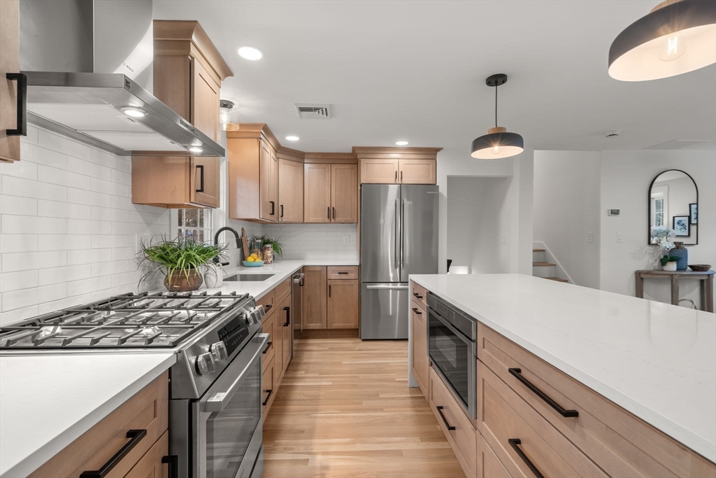 59 Tanbark Road Sudbury, MA 01776 - Photo 11 of 42 a kitchen with a sink stove and refrigerator