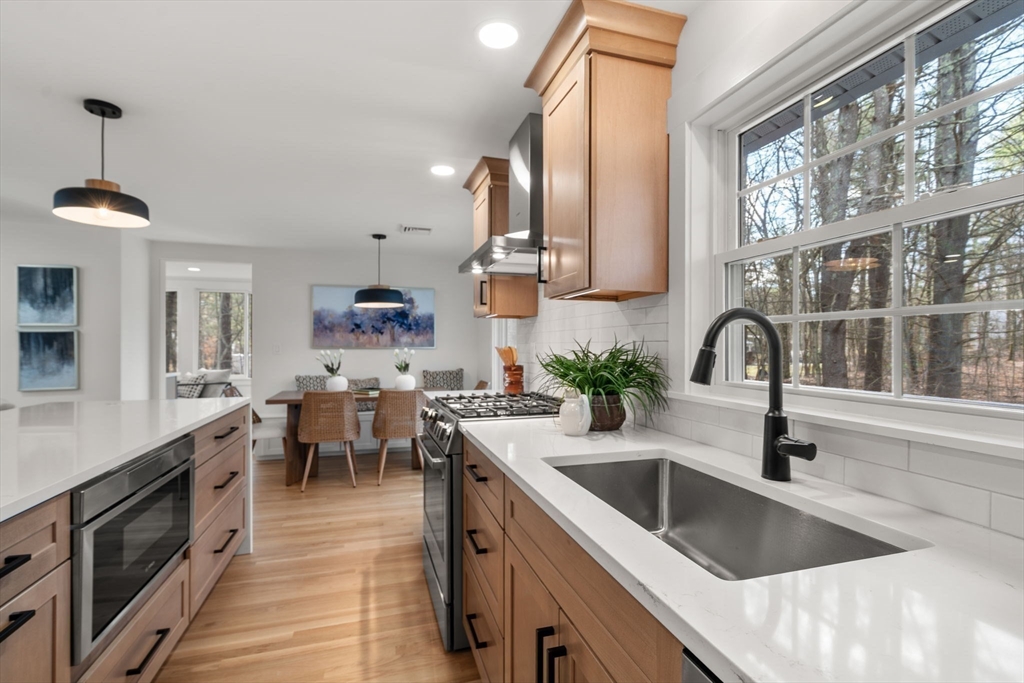 59 Tanbark Road Sudbury, MA 01776 - Photo 12 of 42 a kitchen with a sink and a stove top oven