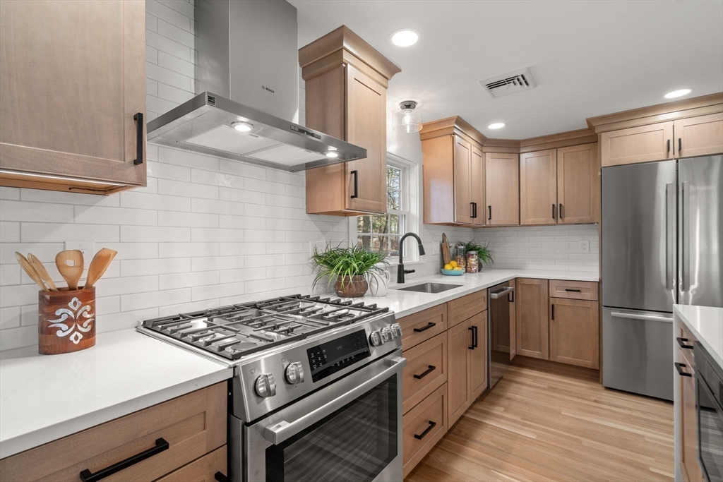 59 Tanbark Road Sudbury, MA 01776 - Photo 13 of 42 a kitchen with a stove and a refrigerator