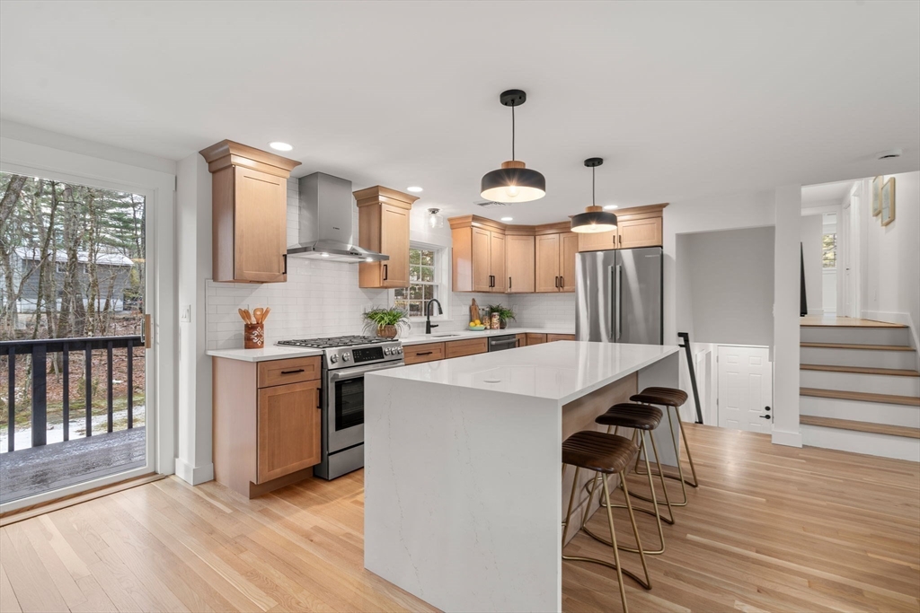 59 Tanbark Road Sudbury, MA 01776 - Photo 14 of 42 a kitchen that has a lot of cabinets a sink and appliances in it