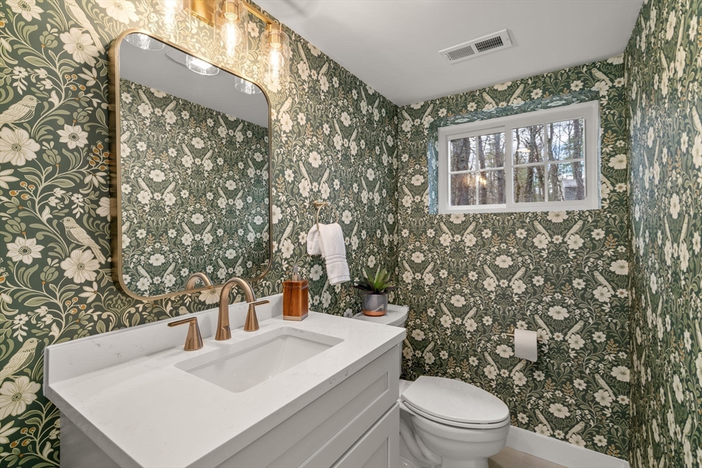 59 Tanbark Road Sudbury, MA 01776 - Photo 19 of 42 a bathroom with a sink a toilet and shower