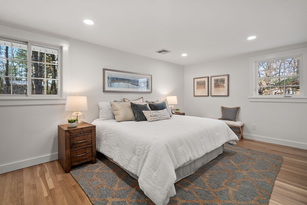 59 Tanbark Road Sudbury, MA 01776 - Photo 21 of 42 a bedroom with a bed and a painting on the wall