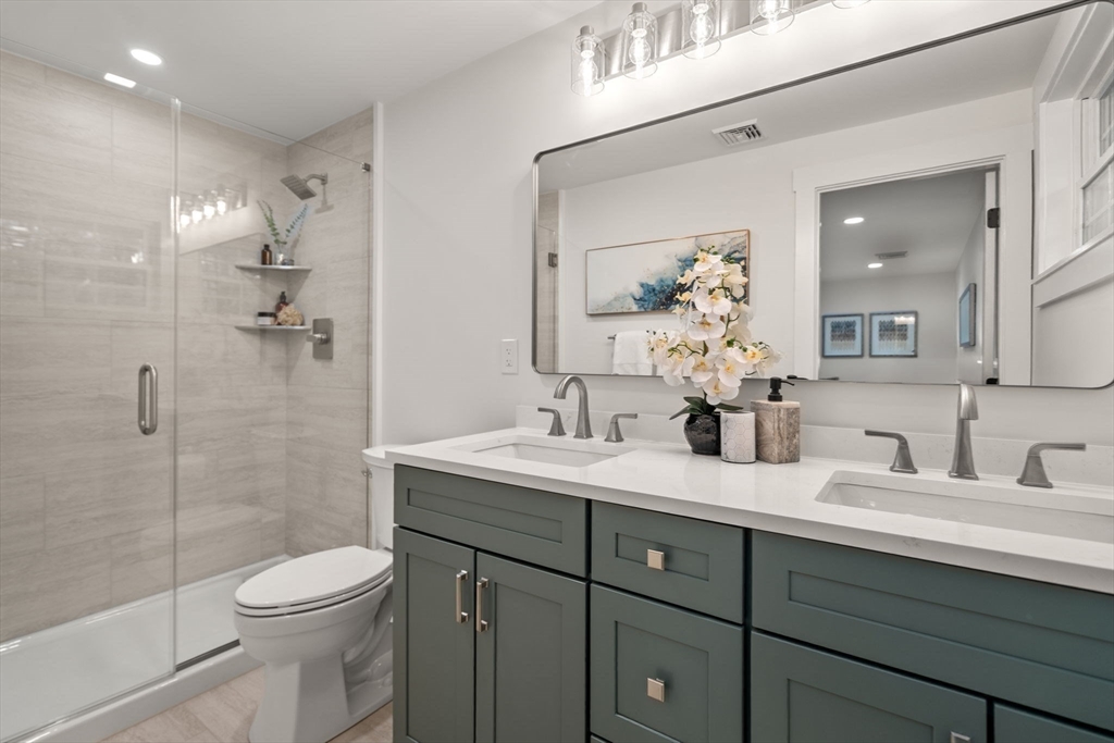 59 Tanbark Road Sudbury, MA 01776 - Photo 24 of 42 a bathroom with a sink a toilet and shower