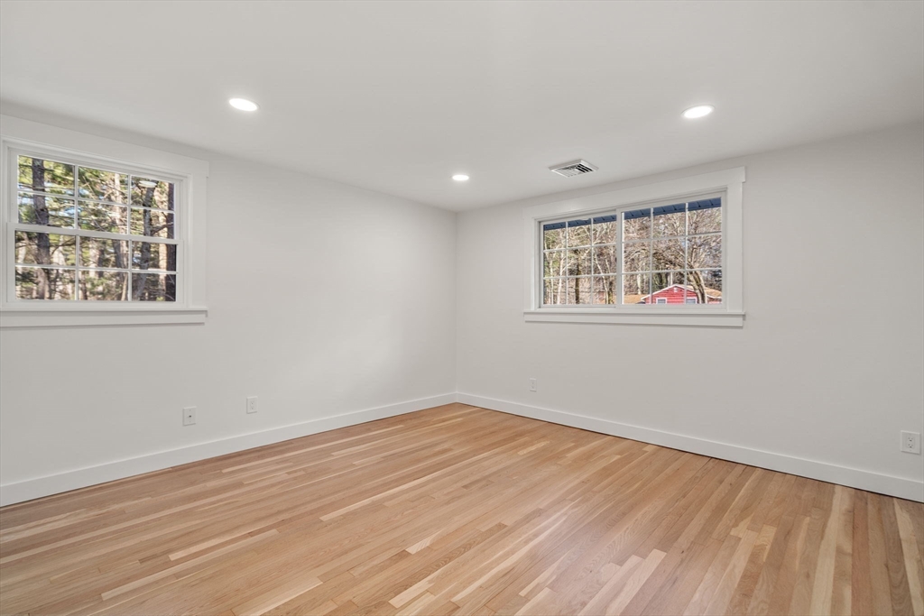 59 Tanbark Road Sudbury, MA 01776 - Photo 25 of 42 a view of empty room with wooden floor and fan