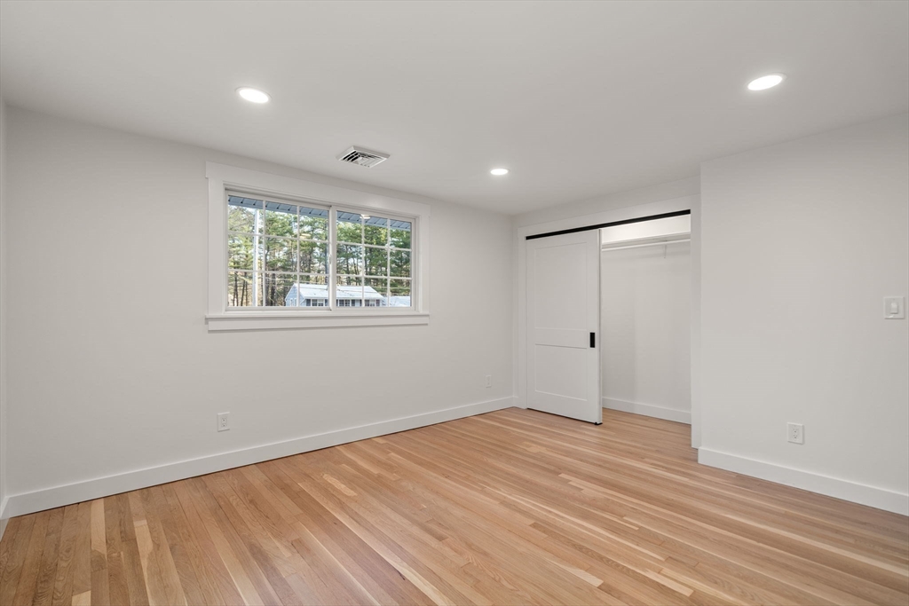 59 Tanbark Road Sudbury, MA 01776 - Photo 26 of 42 a view of empty room with wooden floor and fan
