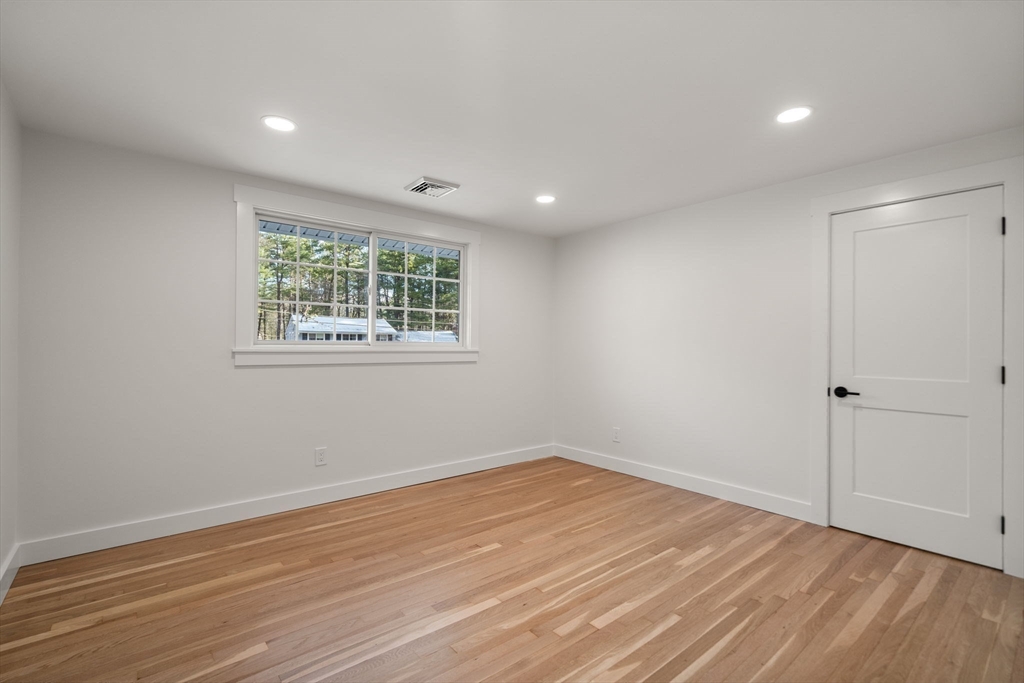 59 Tanbark Road Sudbury, MA 01776 - Photo 27 of 42 a view of empty room with wooden floor and fan