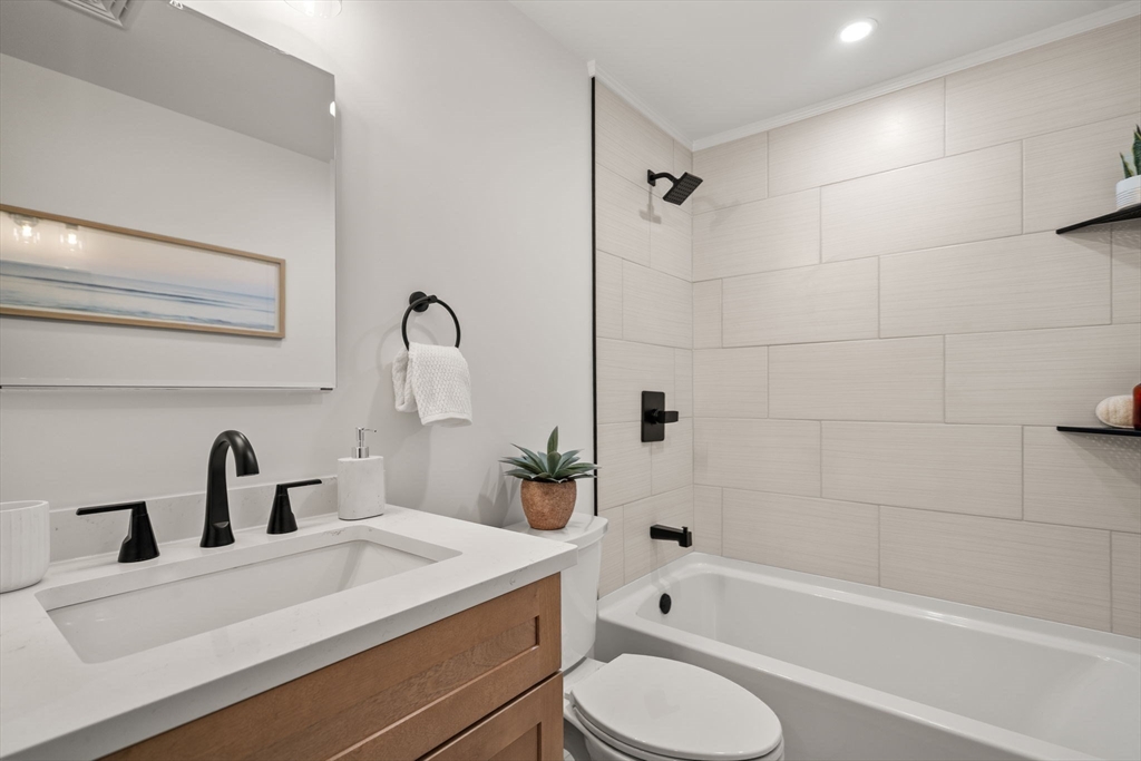 59 Tanbark Road Sudbury, MA 01776 - Photo 28 of 42 a bathroom with a sink a toilet and bathtub