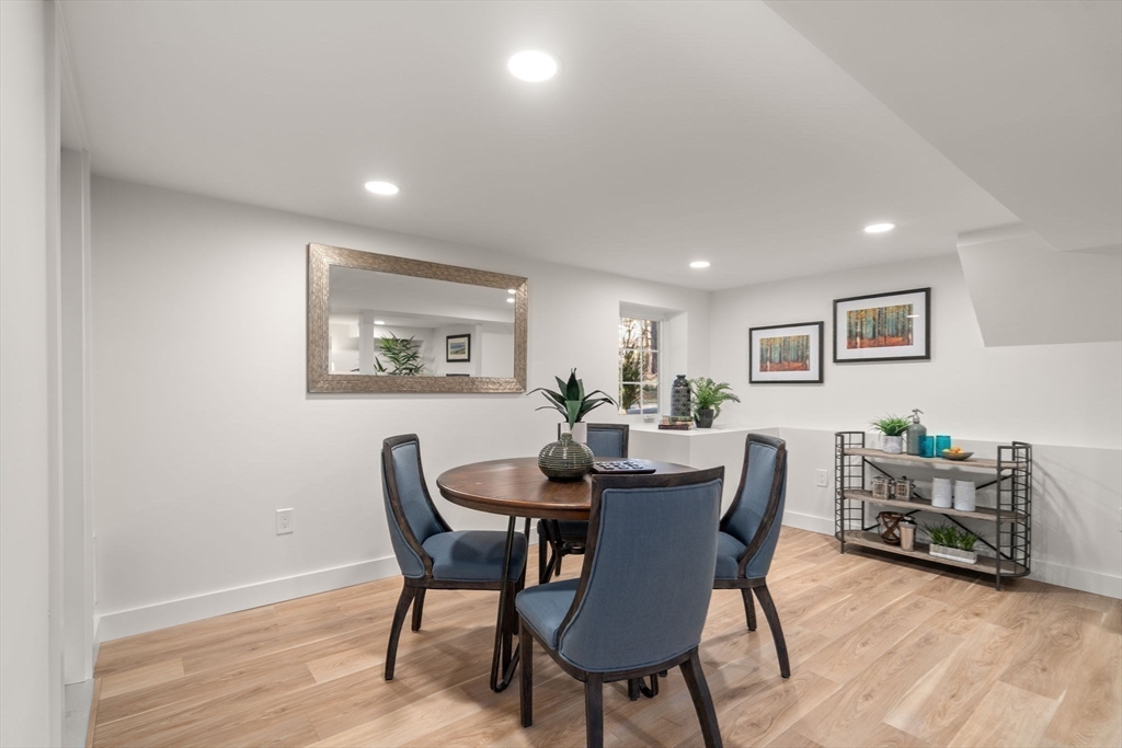 59 Tanbark Road Sudbury, MA 01776 - Photo 33 of 42 a view of a dining room with furniture a rug and wooden floor