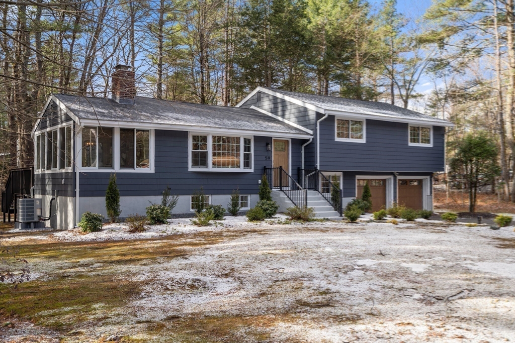 59 Tanbark Road Sudbury, MA 01776 - Photo 39 of 42 a front view of a house with a yard