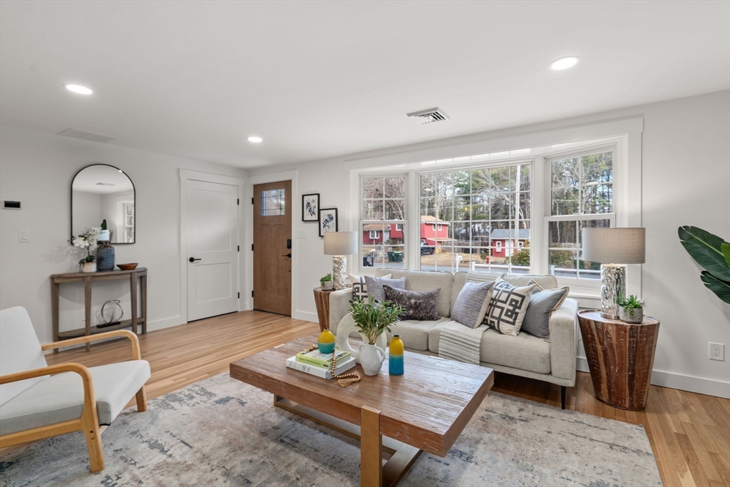 59 Tanbark Road Sudbury, MA 01776 - Photo 7 of 42 a living room with furniture and a table