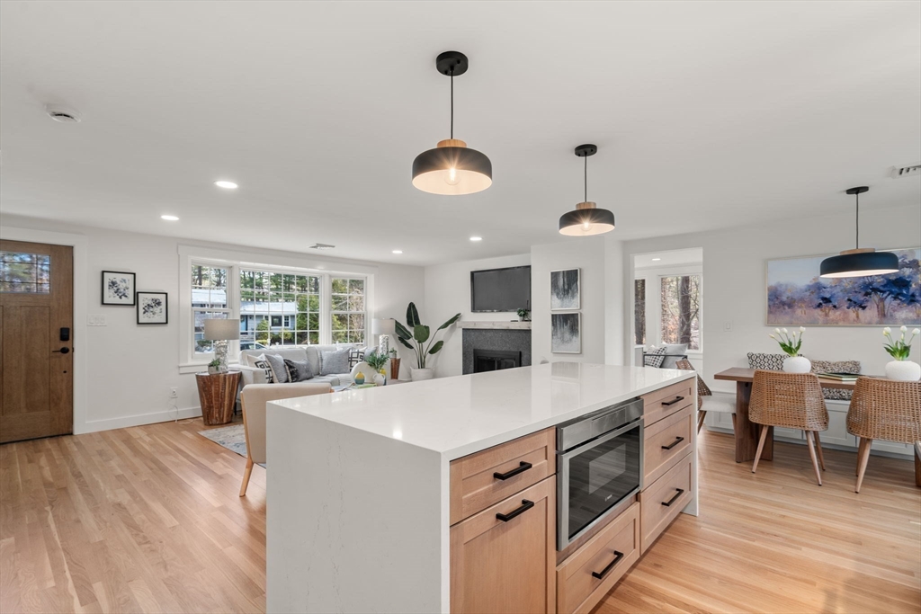 59 Tanbark Road Sudbury, MA 01776 - Photo 10 of 42 a view of a kitchen counter space a sink appliances and living room view