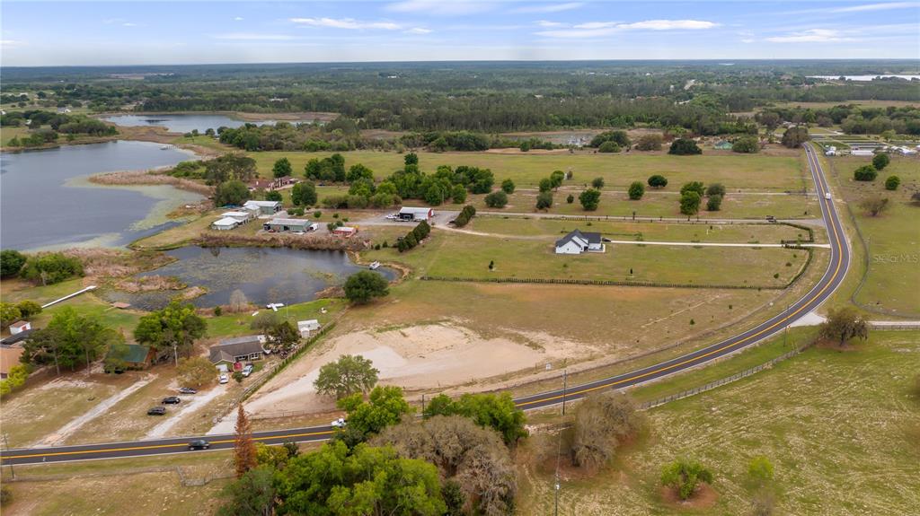 561 County Road Clermont, FL 34711 - Photo 21 of 24 an aerial view of a house with a lake view