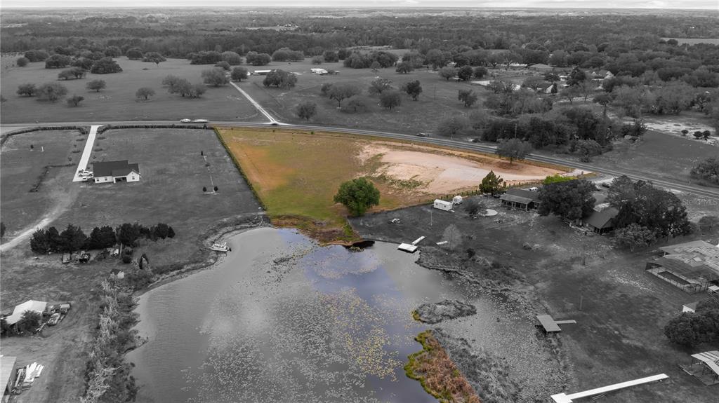 561 County Road Clermont, FL 34711 - Photo 7 of 24 an aerial view of a house with a yard