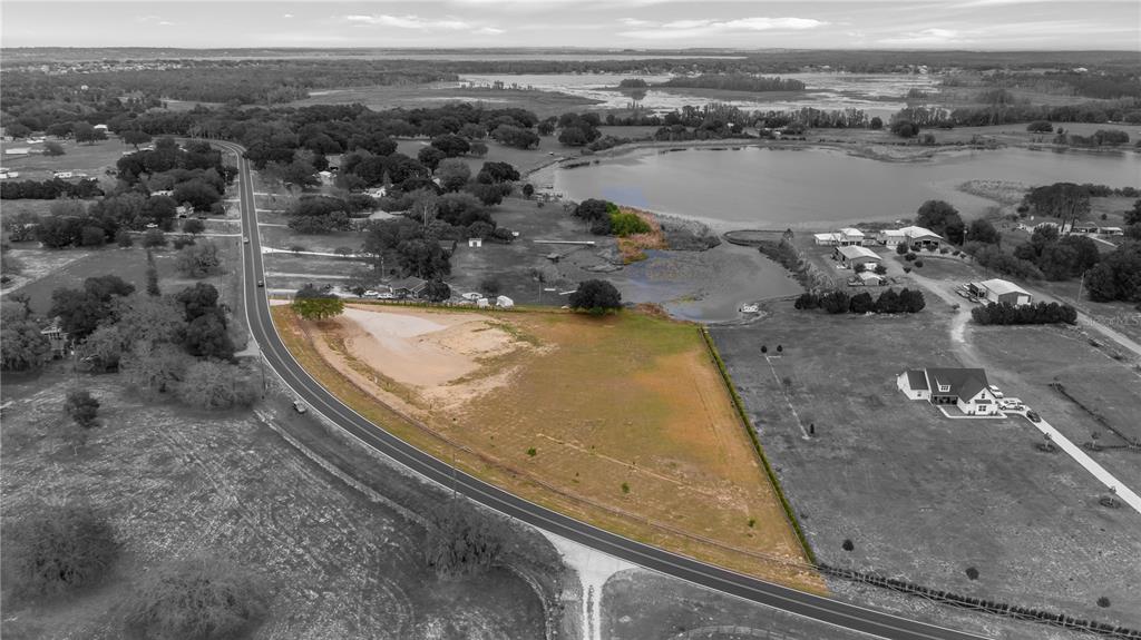 561 County Road Clermont, FL 34711 - Photo 8 of 24 an aerial view of a house with a yard and ocean view
