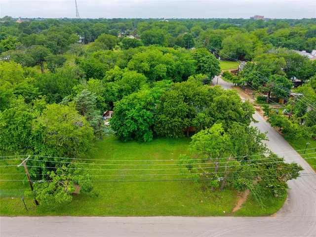 a view of a garden with a building
