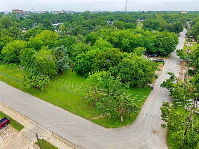 a view of a garden with a building