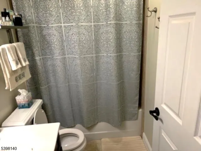 a bathroom with a shower and a sink