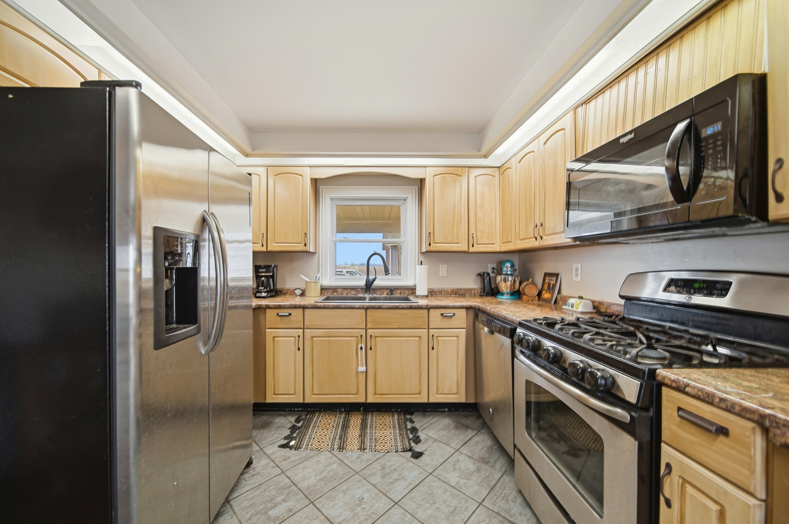 27754 Elm Road Milledgeville, IL 61051 - Photo 13 of 28 a kitchen with stainless steel appliances granite countertop a stove a sink and a refrigerator