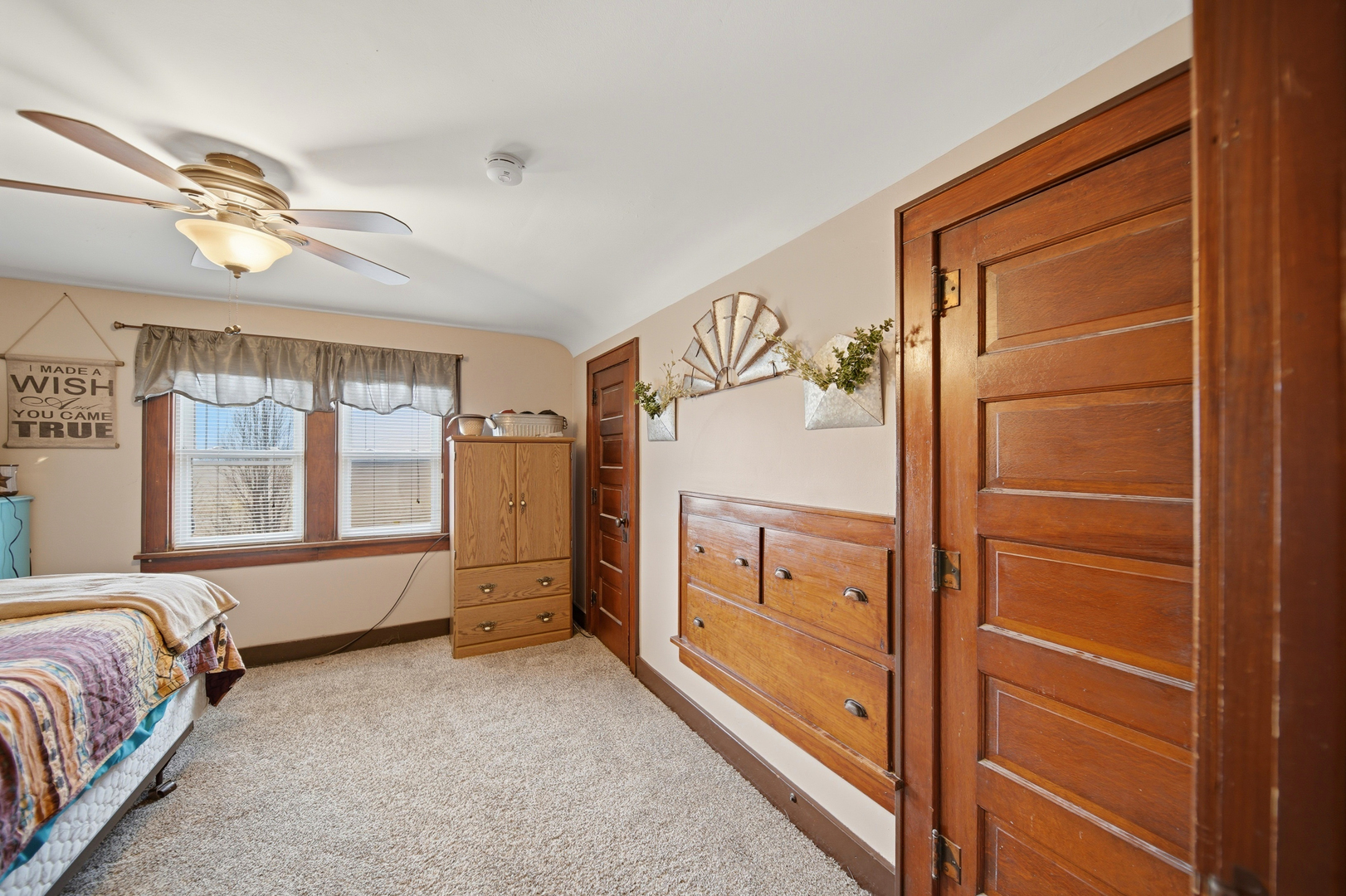 27754 Elm Road Milledgeville, IL 61051 - Photo 22 of 28 a spacious bedroom with a bed dresser and a window