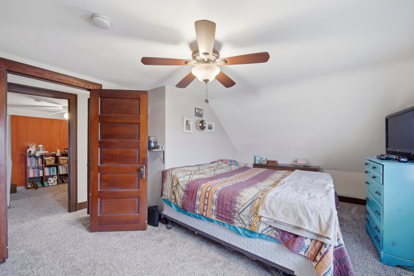 27754 Elm Road Milledgeville, IL 61051 - Photo 23 of 28 a bedroom with a bed and a chandelier