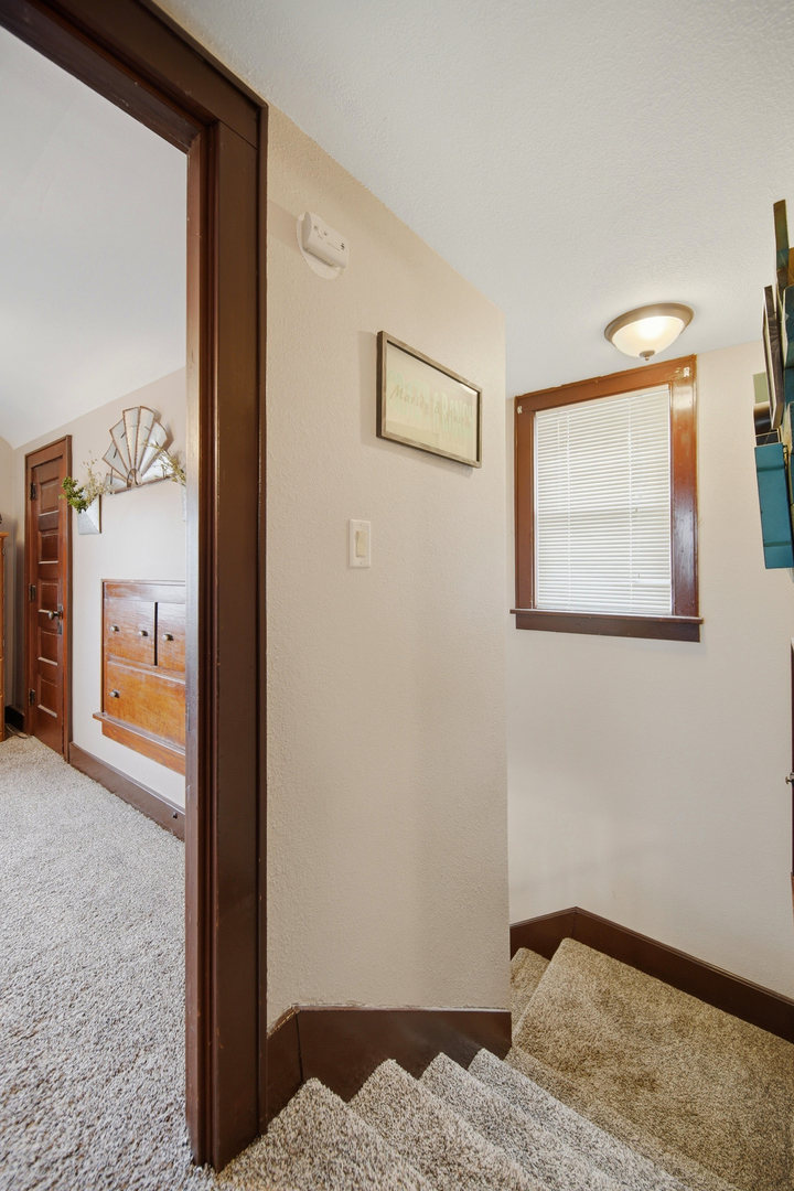 27754 Elm Road Milledgeville, IL 61051 - Photo 25 of 28 a bedroom with a bed and a painting on the wall