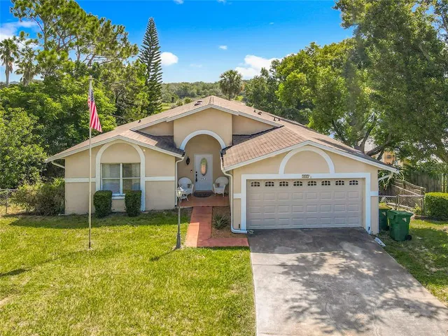 a front view of a house with a yard and porch