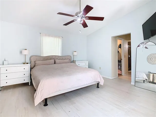 a bathroom with a granite countertop bathtub sink and mirror