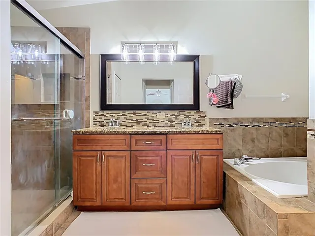 a view of a two chairs with wooden floor in front of house