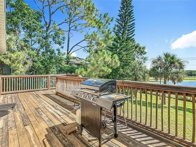 an aerial view of ocean and residential houses with outdoor space and river