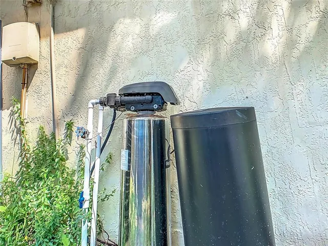 a house with a big yard and large trees