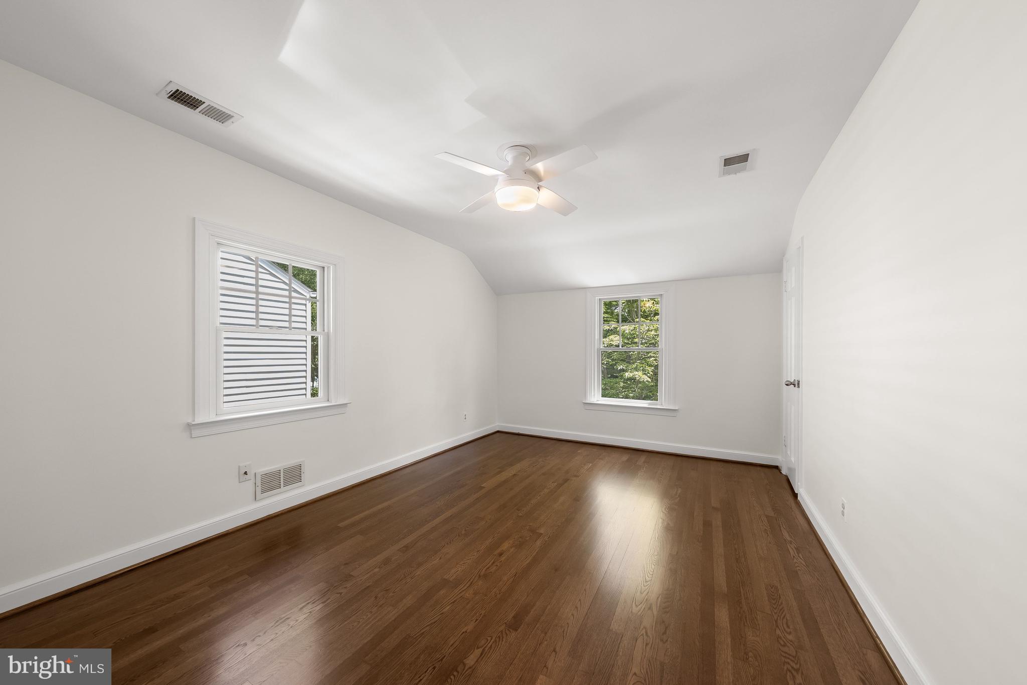 8800 Maywood Avenue Silver Spring, MD 20910 - Photo 26 of 41 wooden floor in an empty room with a window