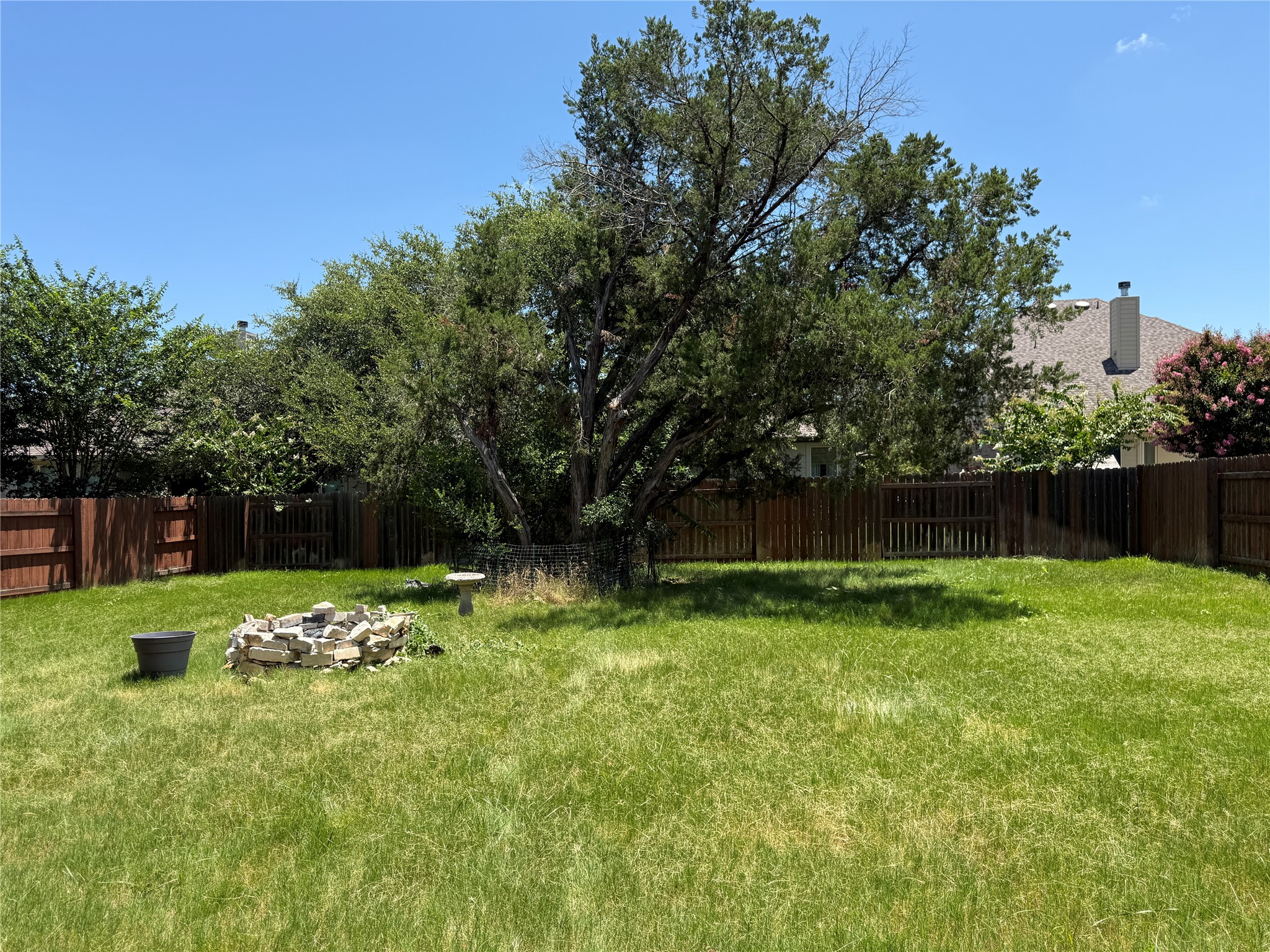 1512 Long Shadow Lane Georgetown, TX 78628 - Photo 18 of 19 a backyard of a house with lots of green space