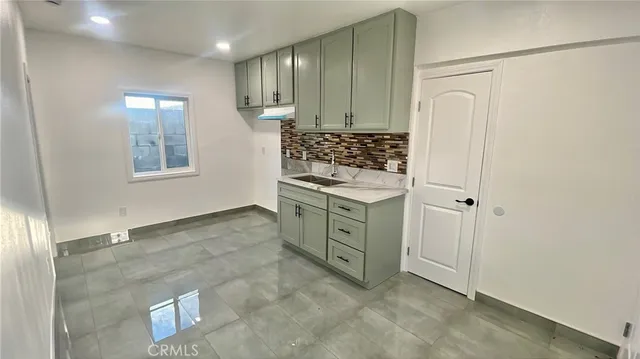 a view of a kitchen with cabinets