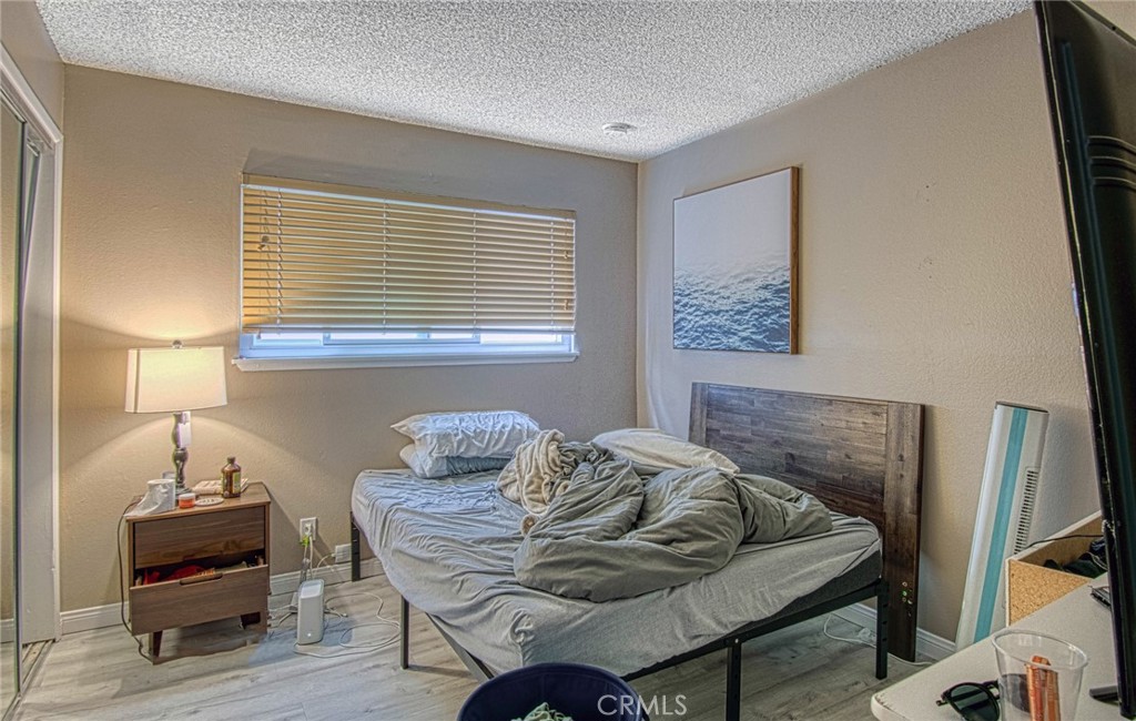 209 Walnut Street Newport Beach, CA 92663 - Photo 12 of 30 a bedroom with furniture and a window