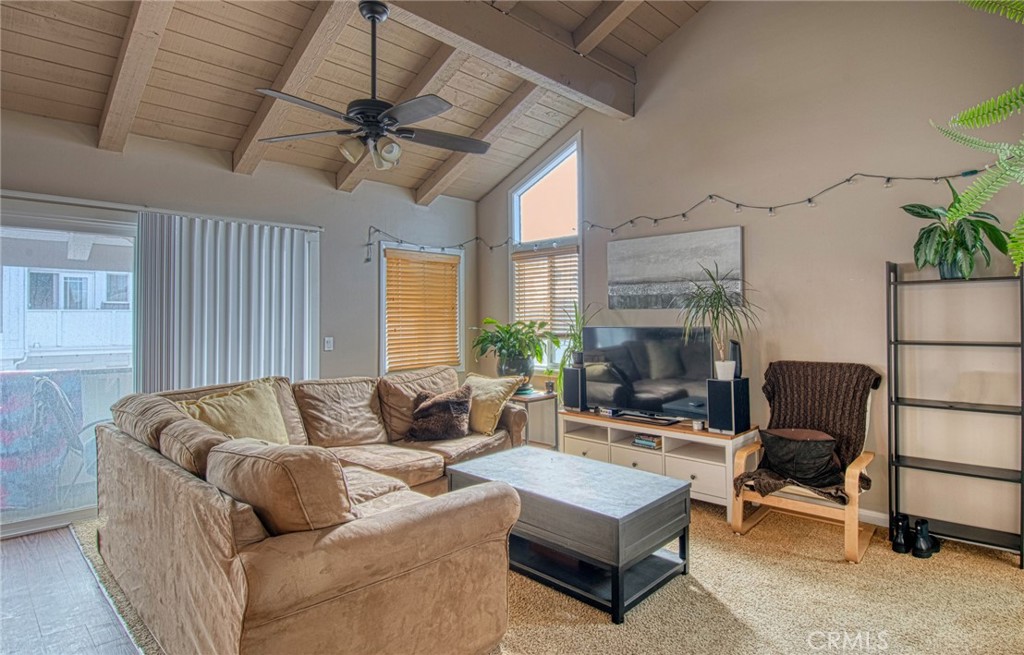 209 Walnut Street Newport Beach, CA 92663 - Photo 15 of 30 a living room with furniture and a large window