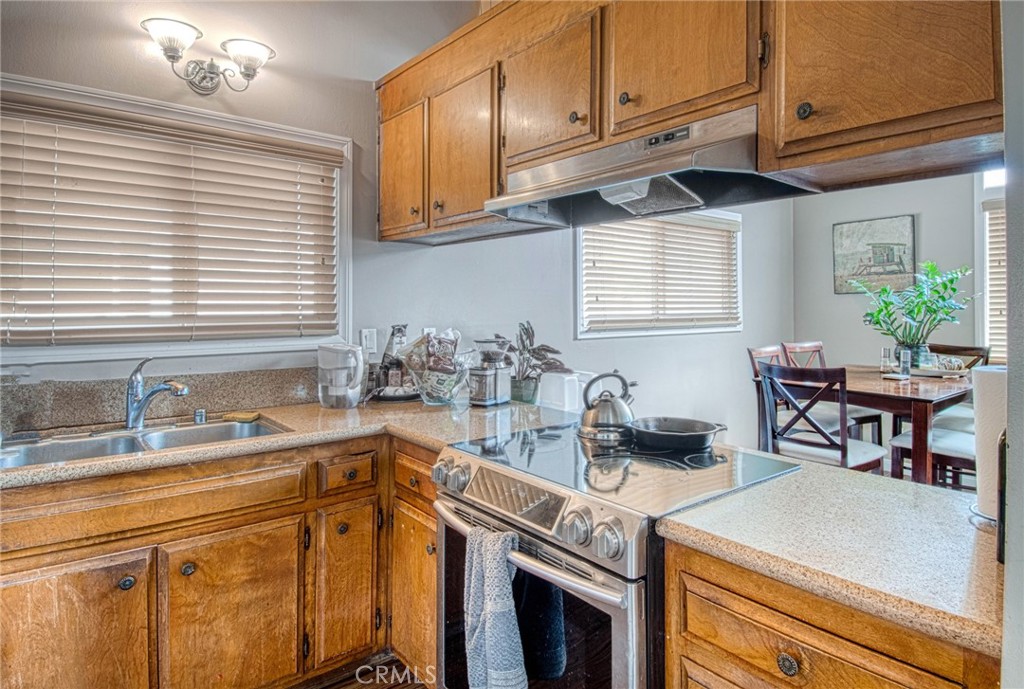 209 Walnut Street Newport Beach, CA 92663 - Photo 20 of 30 a kitchen with a sink cabinets and window