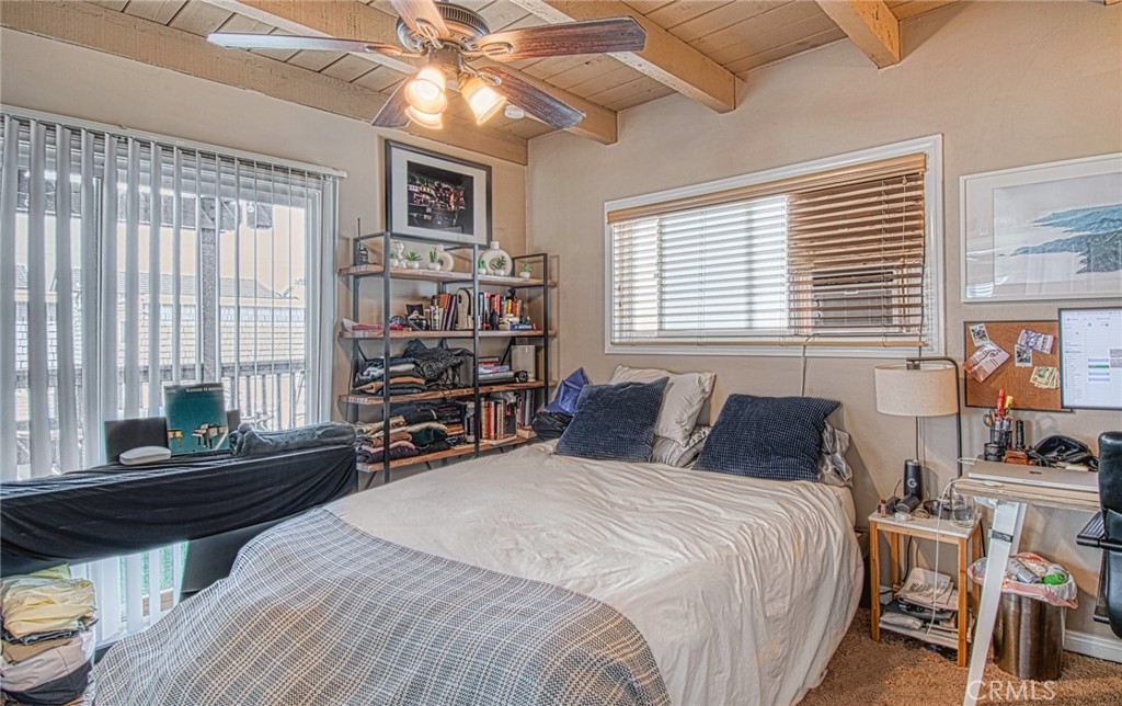 209 Walnut Street Newport Beach, CA 92663 - Photo 22 of 30 a bedroom with a bed furniture and a window