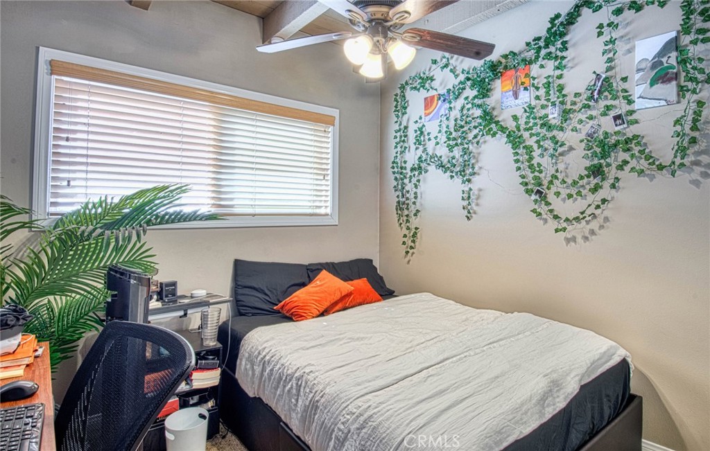 209 Walnut Street Newport Beach, CA 92663 - Photo 24 of 30 a bedroom with a bed and a potted plant