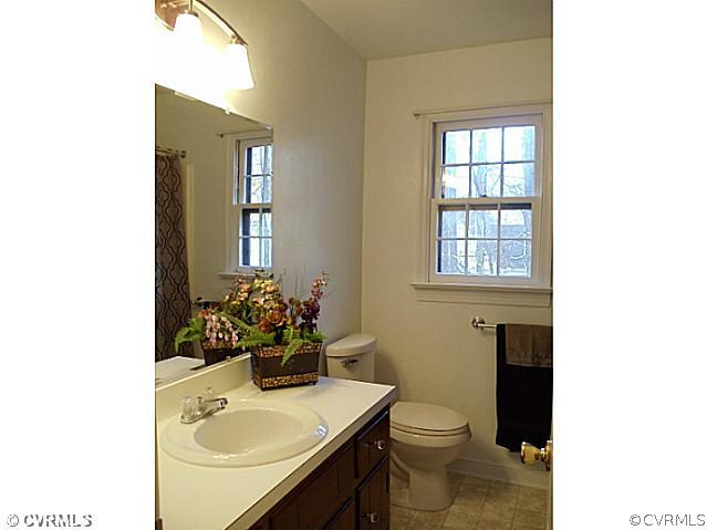 13614 Hunts Bridge Road Midlothian, VA 23112 - Photo 17 of 23 a bathroom with a sink toilet and a mirror