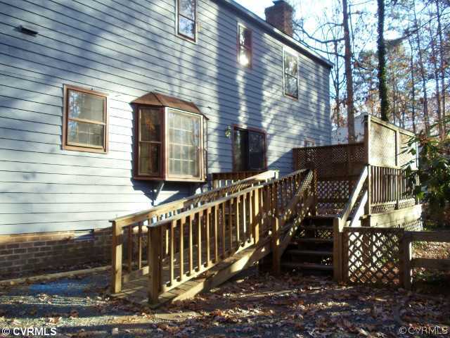 13614 Hunts Bridge Road Midlothian, VA 23112 - Photo 21 of 23 a view of a house with wooden fence