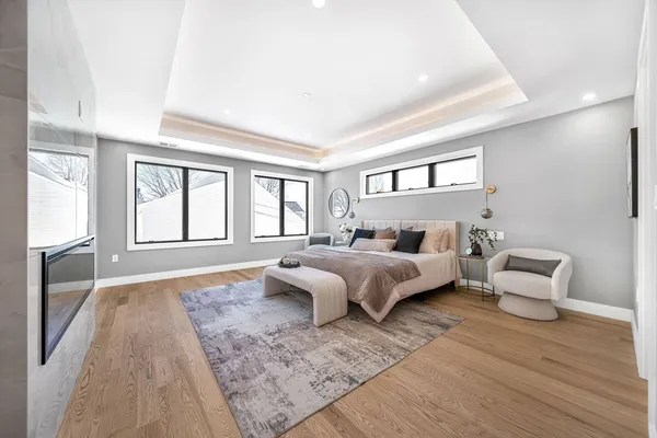 a spacious bedroom with a large bed and a couch