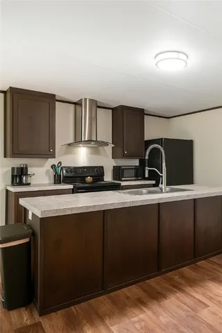 a kitchen with a sink cabinets and appliances