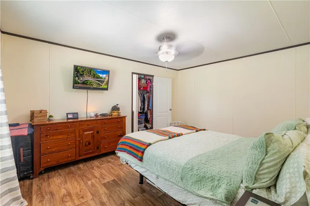 a bed room with a bed and a television