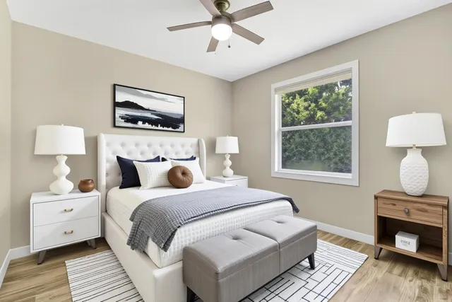 a bedroom with bed and a window