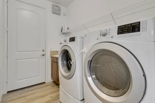 a utility room with dryer and washer