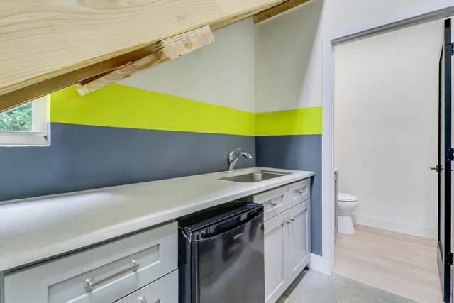 a kitchen with a sink and cabinets